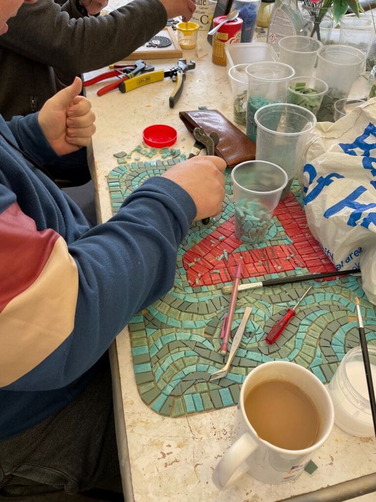People working on their mosaics