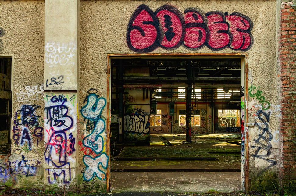 Abandoned building with grafiti  saying sober