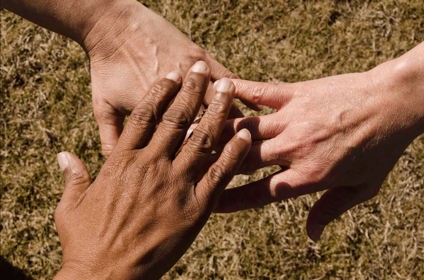 People supporting each other Hands touching each other