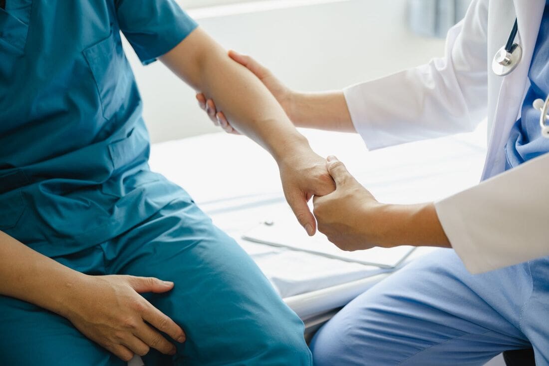 Doctor Helping Patient Credit: Atlanta Bone and Joint specialists Doctor helping patient