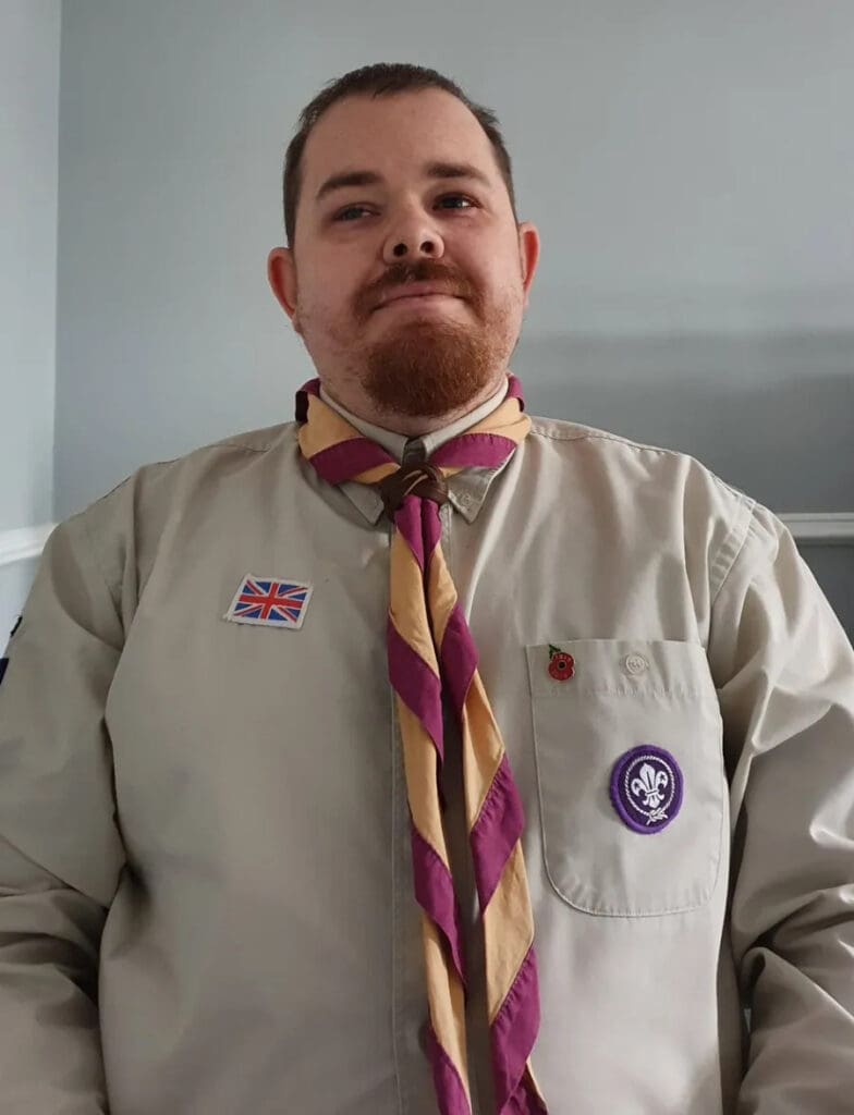 Lee mercer posing for a photo in a scouts uniform 